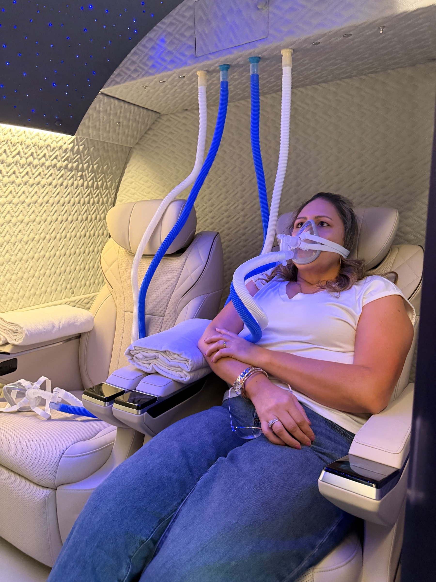 Client relaxing during a guided HBOT visit