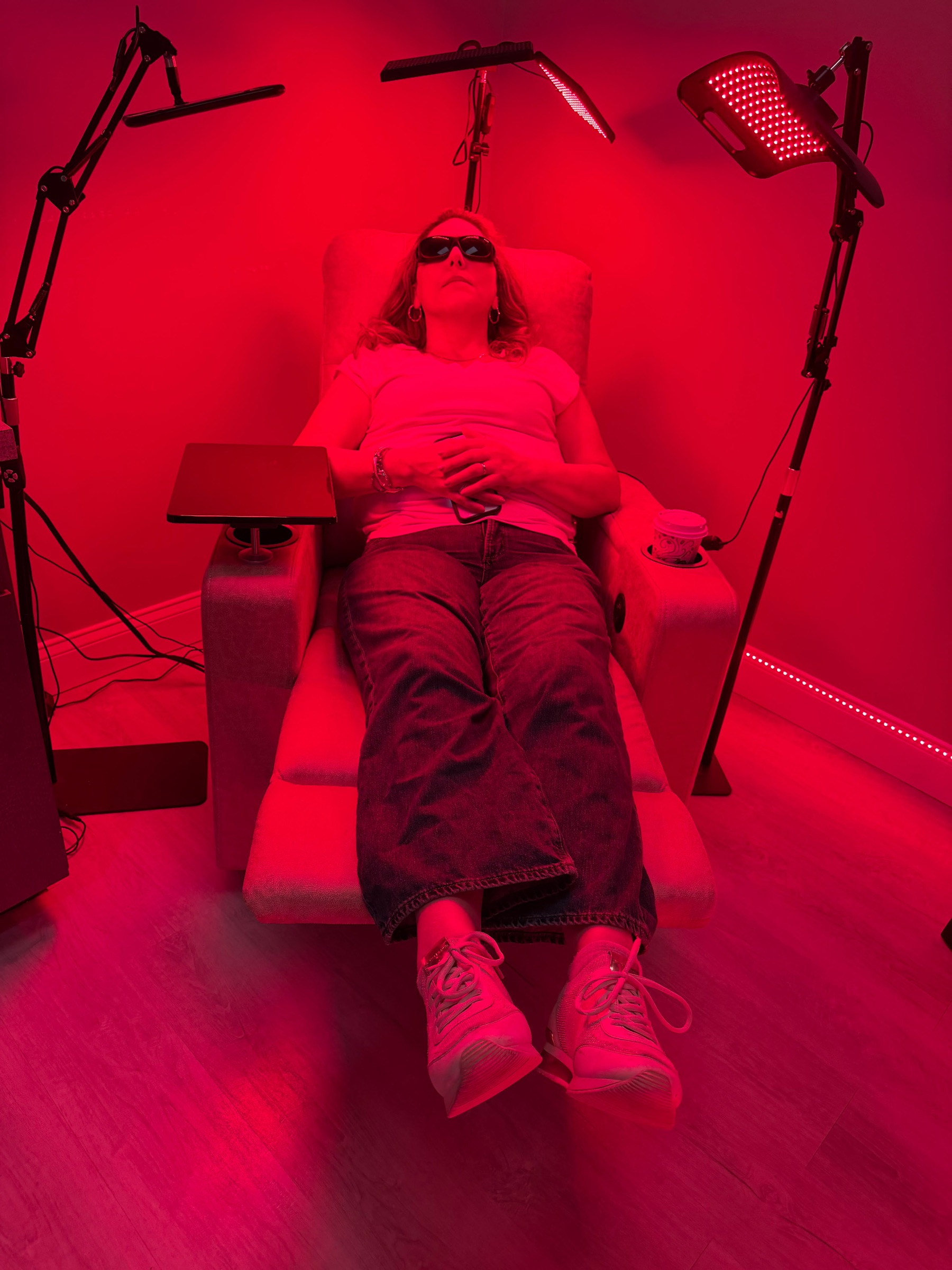 Guest relaxing during red light therapy